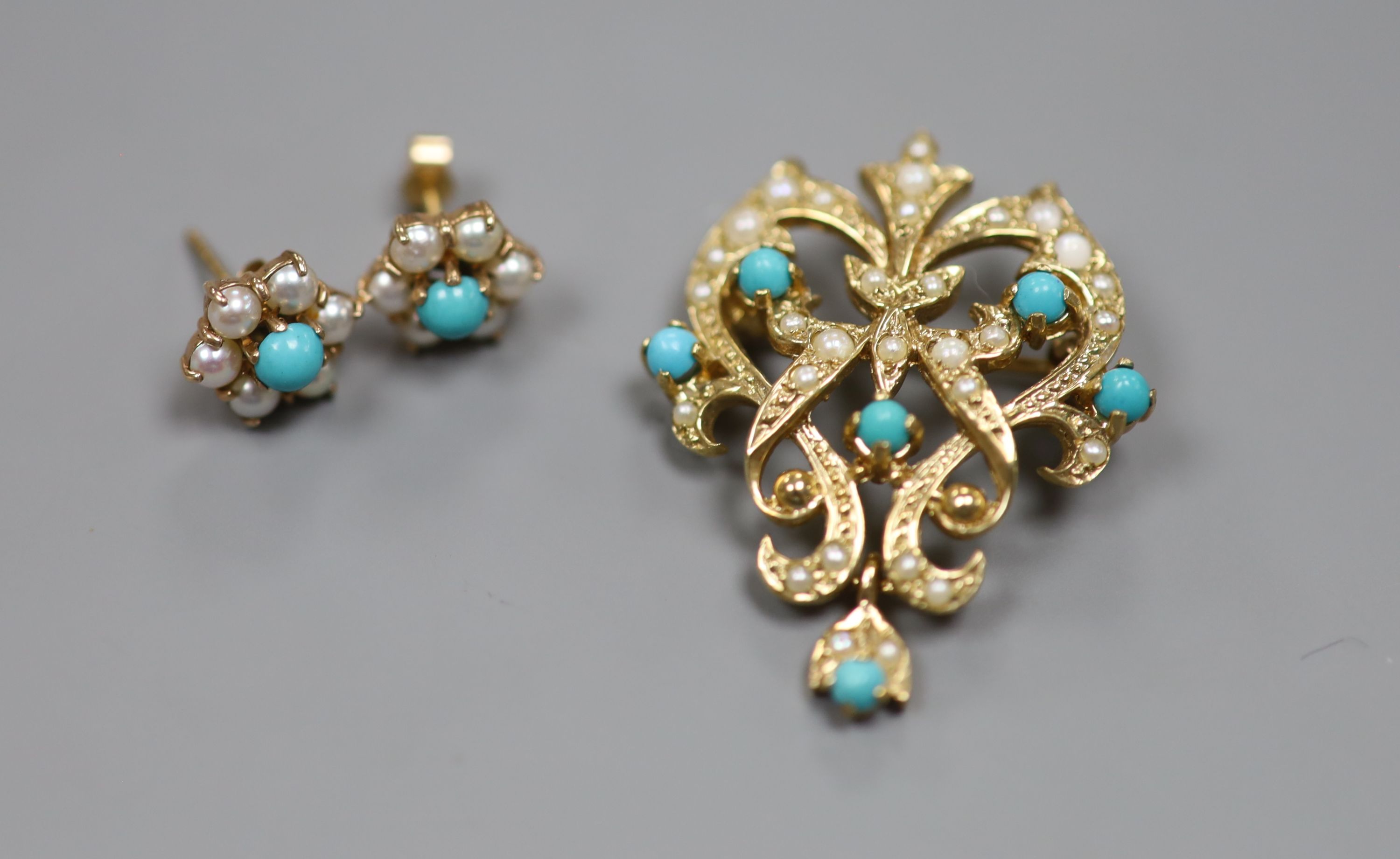 A modern 9ct gold, seed pearl and turquoise set scrolling pendant brooch, 34mm and a pair of matching ear studs